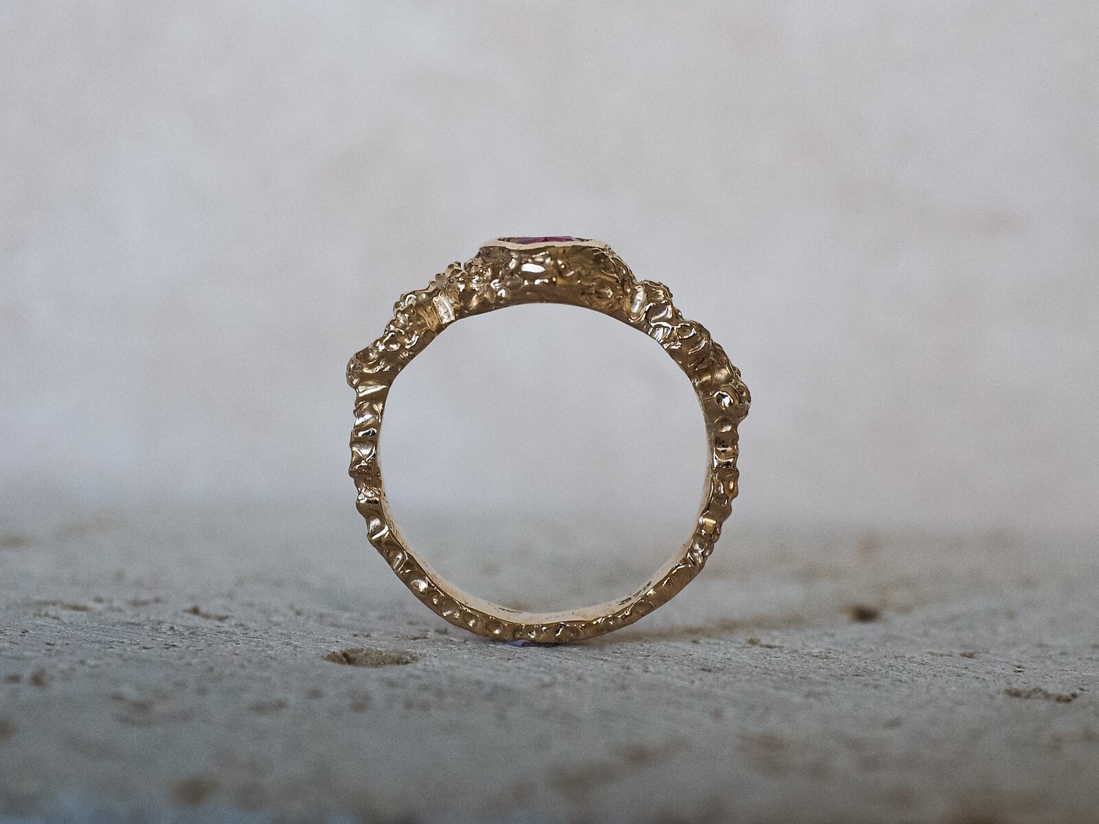 The ring viewed straight on, showing the full band and setting