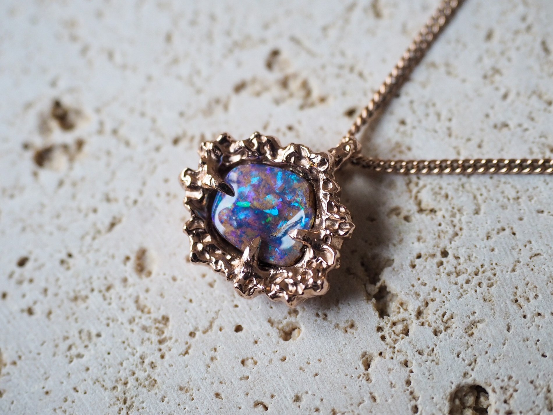 Lagoon, a handcrafted opal pendant in 9ct rose gold