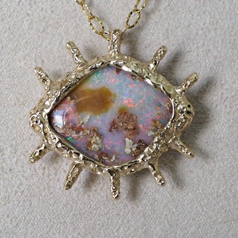 Oculus, a handcrafted opal pendant in 9ct yellow gold